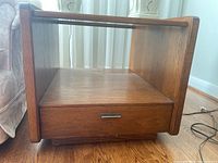 Wood end table front and side view showing the dovetailed drawer and open storage cubby with smoked glass top.