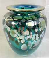 Ione Torkelson signed glass vase with teal iridescent finish and pearlescent circular designs