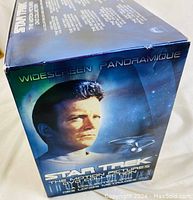 Star Trek boxed DVD set side showing character and starship with widescreen panoramic marking.