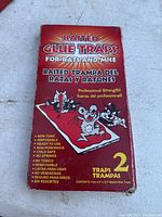 Front of the baited glue traps package showing branding, key features, and quantity (2 traps).