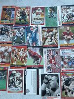 Photo showing multiple NFL football player cards from the Pro Set series, including Donnie Edwards, Matt Miller, Dan Hampton, Joey Browner, Jessie Tuggle, and others.