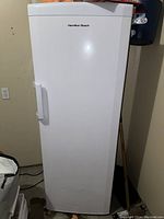 Front view of Hamilton Beach upright freezer in white, showing door and handle.