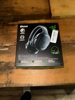 Front view of Razer Barracuda X headset box showing Bluetooth and multi-platform compatibility icons.