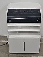 Front view of Kenmore 55550 dehumidifier showing the 50 pints label and air intake grille.