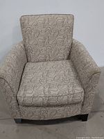 Front view of lounge chair showing upholstery pattern and cushioning