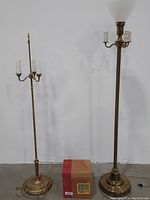 Two vintage brass floor lamps and Longaberger lamp shade boxed, showing full items together