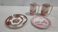 Two china plates made in Japan with fruit and floral design and one Gettysburg commemorative plate plus two matching Gettysburg Staffordshire Ware mugs