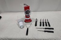 Full lot of slicing and shredding kitchen tools including Kitchen HQ speed grater/slicer, masher, and knives