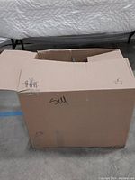 Closed cardboard box labeled for sale containing the solar stake lights.