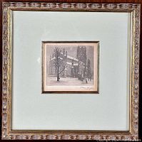 Framed engraving showing the full presentation with ornate frame and mat surrounding the small engraving.