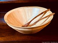 Elm wood salad bowl with teak wood salad fork and spoon resting inside, showing size and design of the lot items.