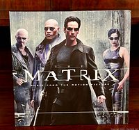 Front view of The Matrix soundtrack vinyl cover showing characters and title.