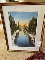 Framed winter scene watercolor painting with river and trees at sunset, signed by J Hiscock.