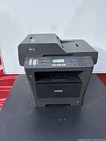 Front angled view of the Brother MFC-8810DW multifunction printer showing overall condition and design.