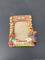 Front view of the Splash Mountain picture frame showing the stone-style border, characters, and logo.