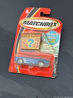 Blue Matchbox Ford Shelby Cobra Concept die-cast car in original sealed packaging with Treasure Inside pirate adventure chest