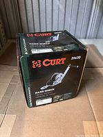 Closed boxed packaging of Curt hand crank winch showing branding and part number 29433.