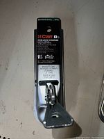 Top-down image showing the Curt Posi-Lock coupler with part number 25153 labeling, locking mechanism and 2 inch ball fitting details.