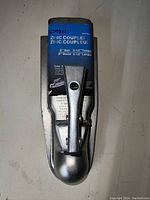 Front view of zinc trailer coupler with blue label showing size and specs.