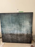 Full view of large square abstract canvas artwork with gray, blue, and dark tones.