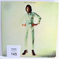 Front of vinyl album cover showing Peter Townshend standing in a light-colored jumpsuit on eggs with title Who Came First.