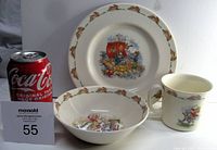 Overall view of Royal Doulton Bunnykins 3-piece set including plate, bowl, and cup with Coca-Cola can for scale.