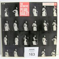 Front cover of The Definitive Pearl Bailey vinyl album showing a collage of photos of Pearl Bailey and album title with Columbia label.