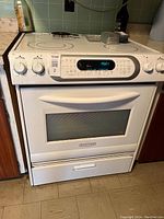 Front view of KitchenAid white electric stove showing control panel and oven door with error code F5E1 on display