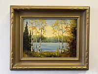 Frontal view of the oil painting in its gold frame showing the full artwork and signature