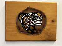 Overall view of the rectangular wooden plaque with the agate slice center featuring the detailed Thunderbird painting.