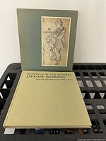 Front and side view of the Drawings of the Masters Japanese Drawings hardcover book with slipcase, showing intact cover and spine text.