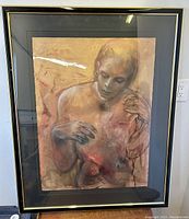 Full view of framed mixed media painting depicting abstract male figure on warm beige background with black frame and gold trim.