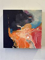 Full view of vibrant abstract acrylic painting on wood board with color blocks of orange, red, black, blue, and white accents.