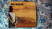Front cover of vintage 12-inch vinyl LP album 'A Morning Raga / An Evening Raga' by Ravi Shankar showing him in traditional attire against a sky background.