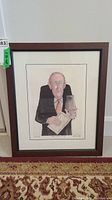 Front view of framed print 'Dry & Unexciting' by Sue Macartney-Snape showing cartoonish man holding a book and glass.