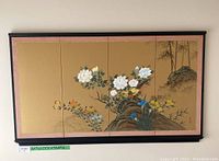 Front view of the large 4-panel Asian hand painted silk tapestry mounted on the wall showing detailed floral and bird artwork with black wooden frame.