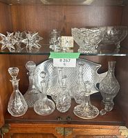 Overview of top and bottom shelves showing all crystal pieces, tray and figurines