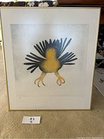 Front view of framed print showing stylized owl with yellow body and black feathers against white mat and gold-tone frame