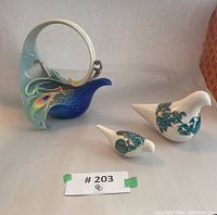 Franz bird teapot and two Sokreh bird figurines on neutral background, front view