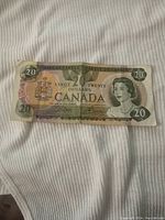 Front side of 1979 Canadian $20 bill showing Queen Elizabeth II portrait and denomination