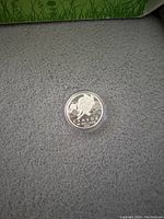 Photo of the front side of the silver coin showing the turtle design, Canadian denomination, and date.