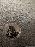 Obverse side showing a cougar and denomination of 20 dollars with 'CANADA' inscription