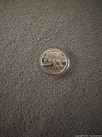 Obverse side of 2014 silver coin showing polar bear design, denomination $50 and year 2014