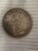Obverse side of the 1963 Canadian silver dollar coin showing Queen Elizabeth II profile.
