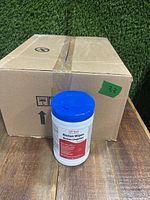 Photo of one container of QT-San BioSan Wipes in front of the shipping box, showing blue cap and label.