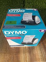 Front top view of sealed original box for Dymo LabelWriter 4XL thermal label printer, showing product image and branding.