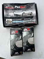 Closed boxes of ProMax and PBR brake pads showing product branding and packaging condition.