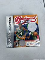 Sealed copy of Backyard Sports Basketball for Game Boy Advance showing front cover artwork with Celtics player and NBA 2007 license badge. Box appears sealed with plastic wrap intact.