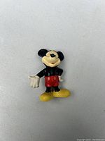 Front view of vintage Mickey Mouse mini-figure showing colors and condition.