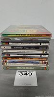 Stack of 10 reggae music CDs including Bob Marley and others, showing spines with titles and labels.